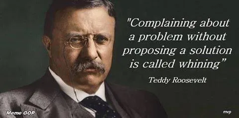 A portrait of Theodore Roosevelt with a stern expression, wearing glasses, a suit, and tie, overlaid with a quote attributed…