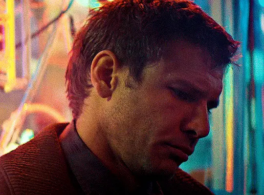 The image shows six panels of actor Harrison Ford in a dimly lit, neon-colored environment, likely from the movie 'Blade…