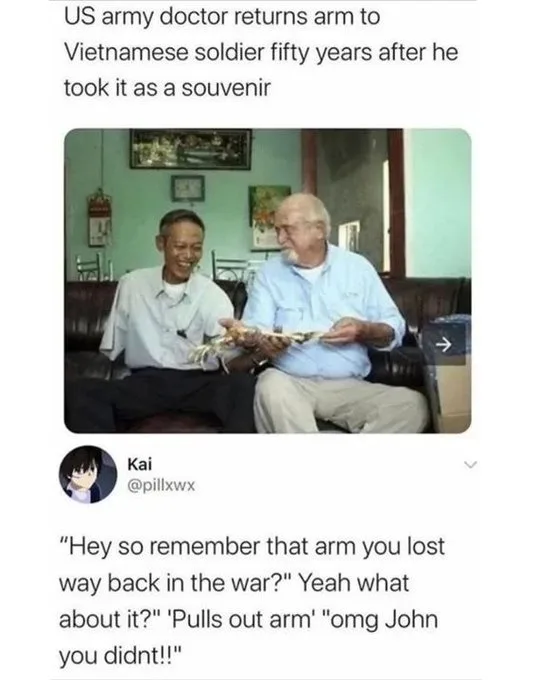 Two elderly men sit on a couch; the man on the right holds a prosthetic arm and smiles while the man on the left laughs. The…