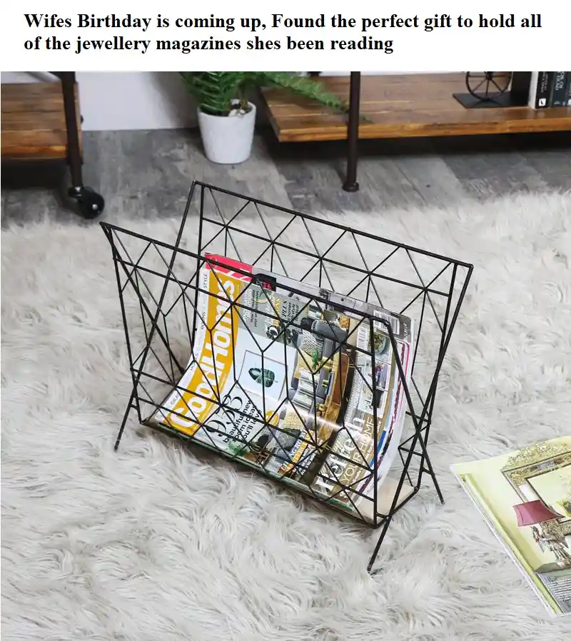 A black wire magazine rack filled with fashion and jewellery magazines sits on a fluffy white rug. The overlaid text reads…
