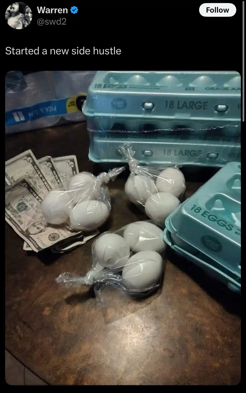 A photo shows several stacks of US dollar bills lying next to multiple clear plastic bags filled with white eggs, with blue…