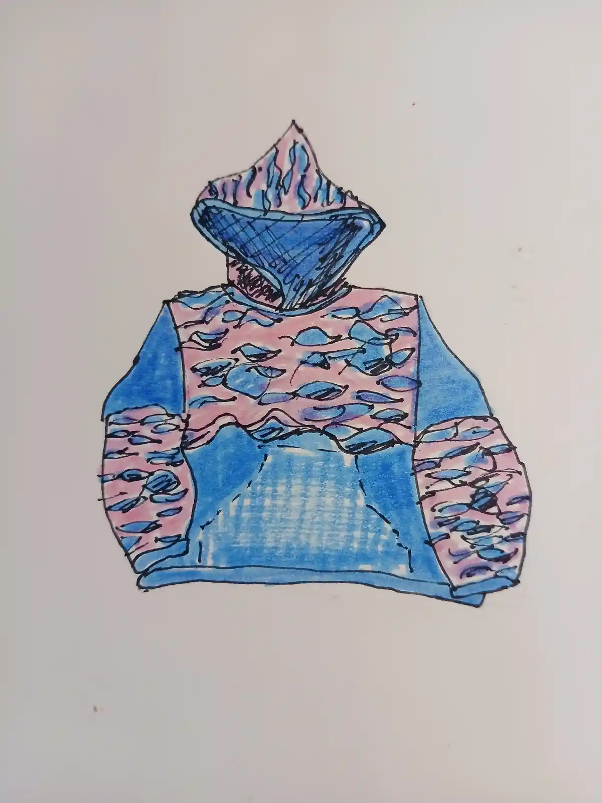 A hand-drawn, colorful sweater illustration features a mountain peak as its hood, with blue and pink patterns resembling…