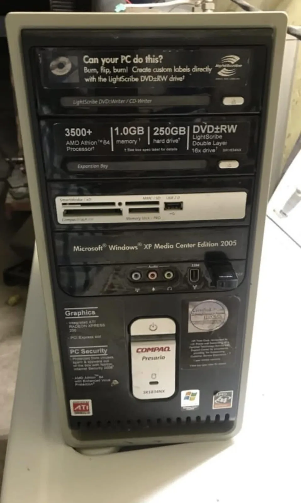 The image shows the front panel of an old Compaq Presario desktop computer, featuring a sticker that reads 'Can your PC do…