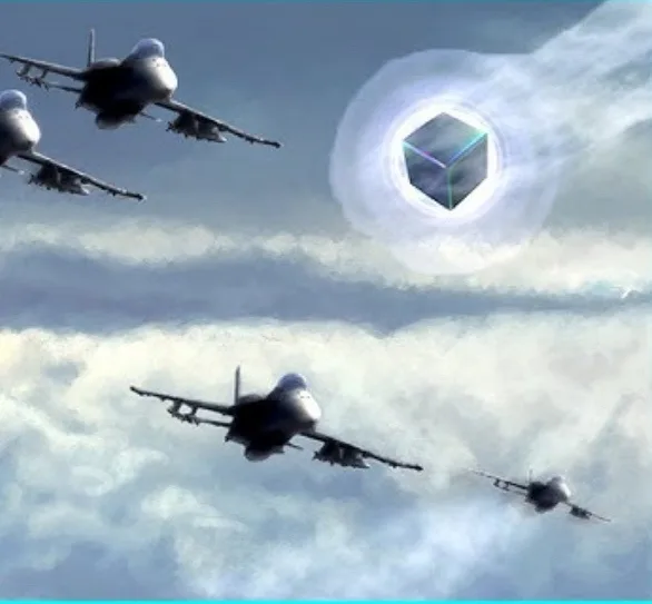 Four fighter jets fly through a cloudy sky toward a glowing, translucent cube floating in the air. The cube has a geometric…