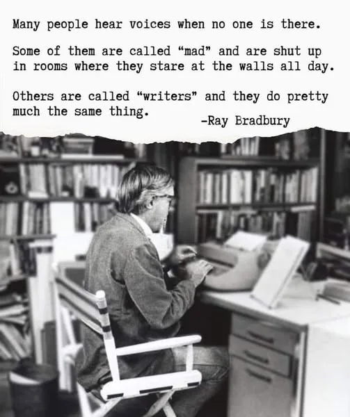 A black-and-white photo shows a man with glasses sitting in a director's chair at a desk with a typewriter, surrounded by…