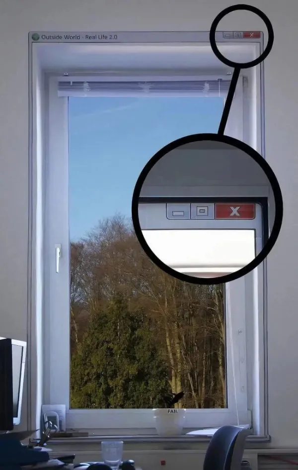 A real window in a room is humorously overlaid with a computer window interface, complete with minimize, maximize, and close…