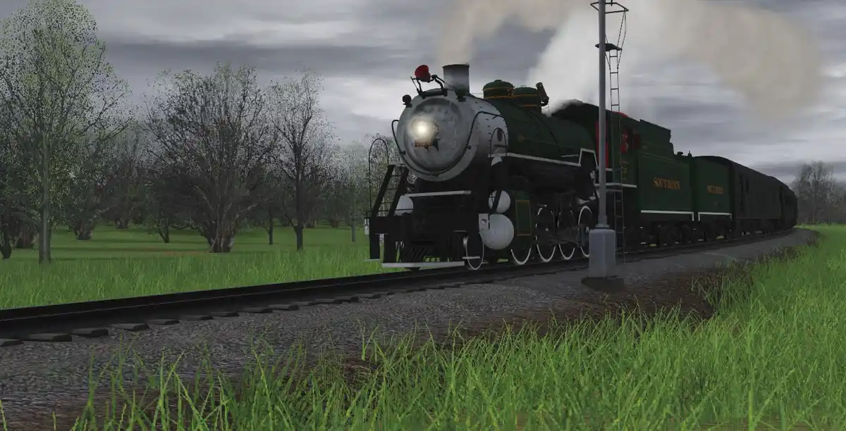 A green steam locomotive with 'SOUTHERN' written on its side is shown on a railway track in a grassy field under an overcast…