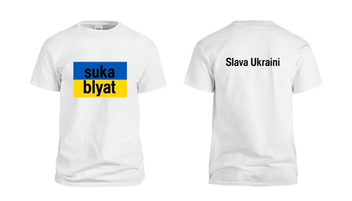 Two white t-shirts are shown, front and back. The front has the Ukrainian flag colors with the words 'suka blyat' in black…