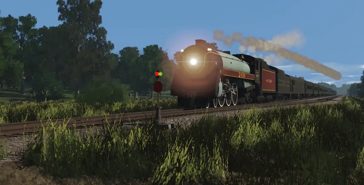 A steam locomotive with the number 2539 and 'SUTHERS' on its side is approaching on a railway track through a grassy field…
