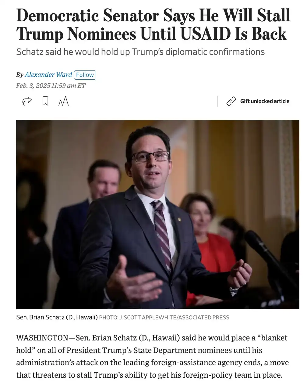 A screenshot of a news article shows Senator Brian Schatz speaking at a podium, wearing a suit and glasses, with blurred…