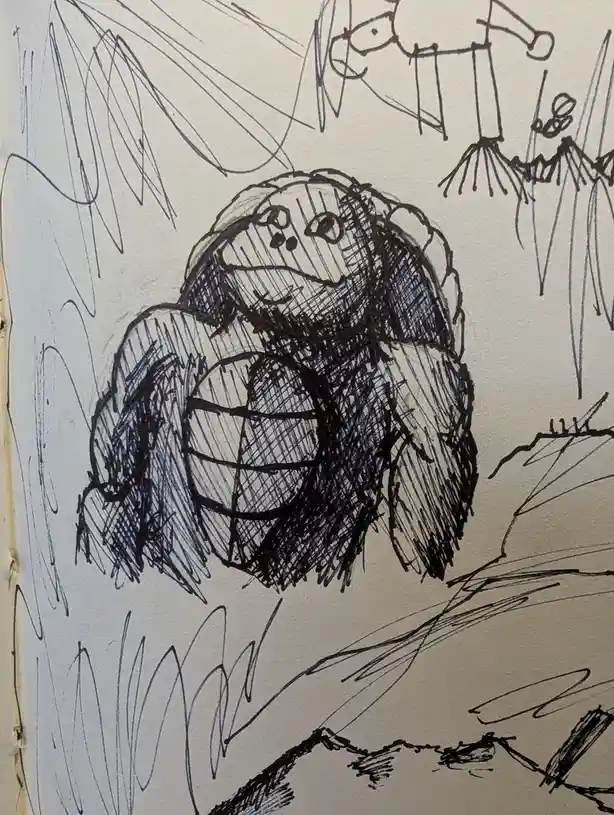 A child's black ink drawing shows a large, furry creature with a round, segmented body and a smiling face, holding a…