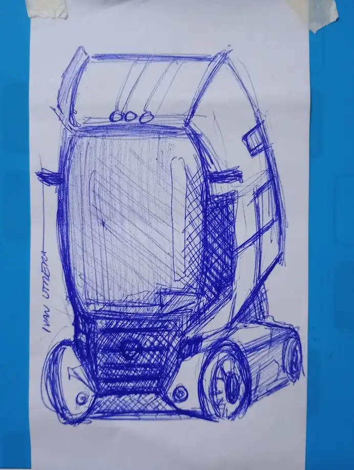 A blue ink sketch on white paper shows a futuristic, boxy vehicle with large windows, four wheels, and a somewhat cartoonish…