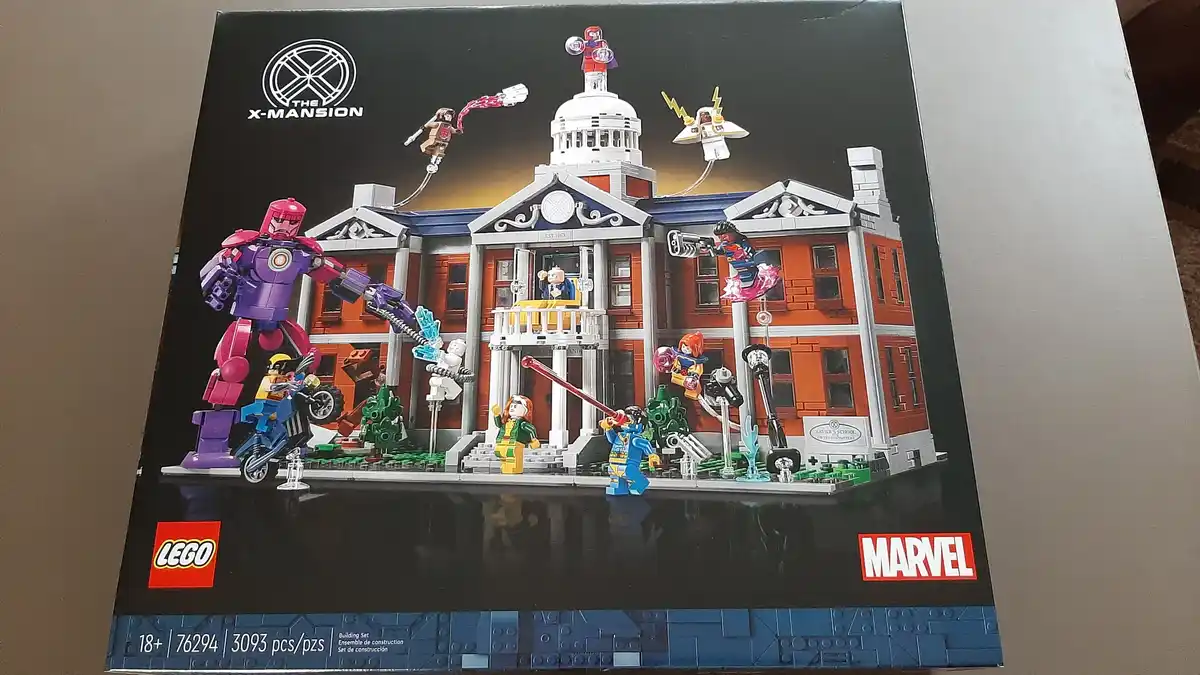 The image shows the front of a LEGO Marvel set box for 'The X-Mansion' (set #76294), featuring a large, detailed LEGO model…
