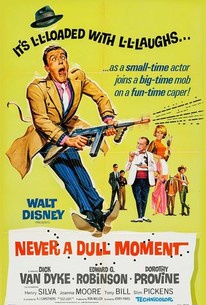 A vintage Walt Disney movie poster for 'Never a Dull Moment' shows a man in a tan suit and fedora, holding a large gun and…