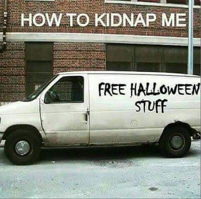A white van parked in front of a brick building with 'HOW TO KIDNAP ME' written above the windows and 'FREE HALLOWEEN STUFF'…