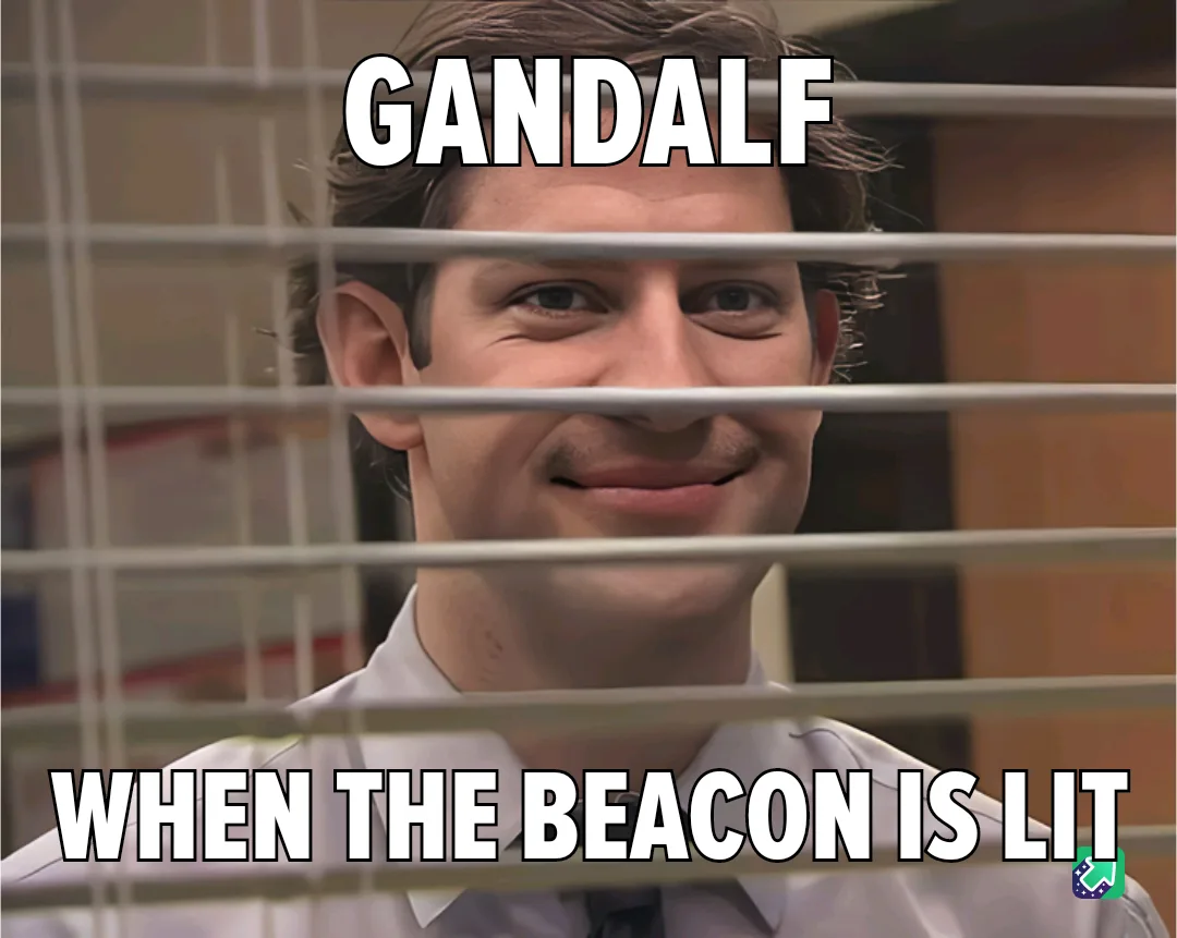 A man in a white collared shirt smiles mischievously through office blinds, with the text 'GANDALF' at the top and 'WHEN THE…
