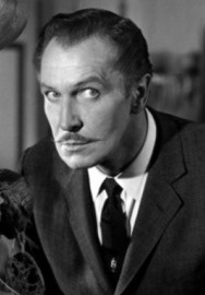 A black-and-white photo of a man with a mustache, wearing a suit and tie, looking intensely at the camera. The text overlaid…