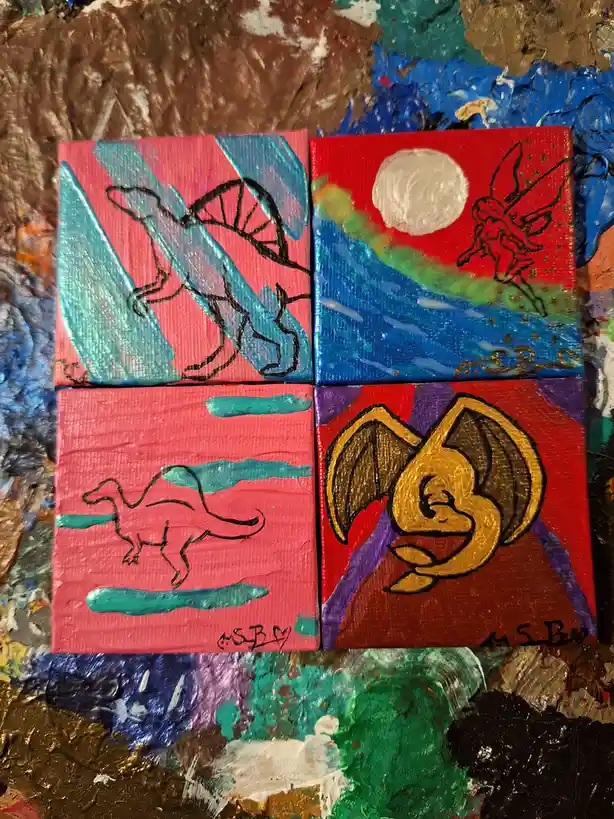 Four small, colorful paintings arranged in a grid on a paint-splattered surface. Each depicts a different creature: top-left…