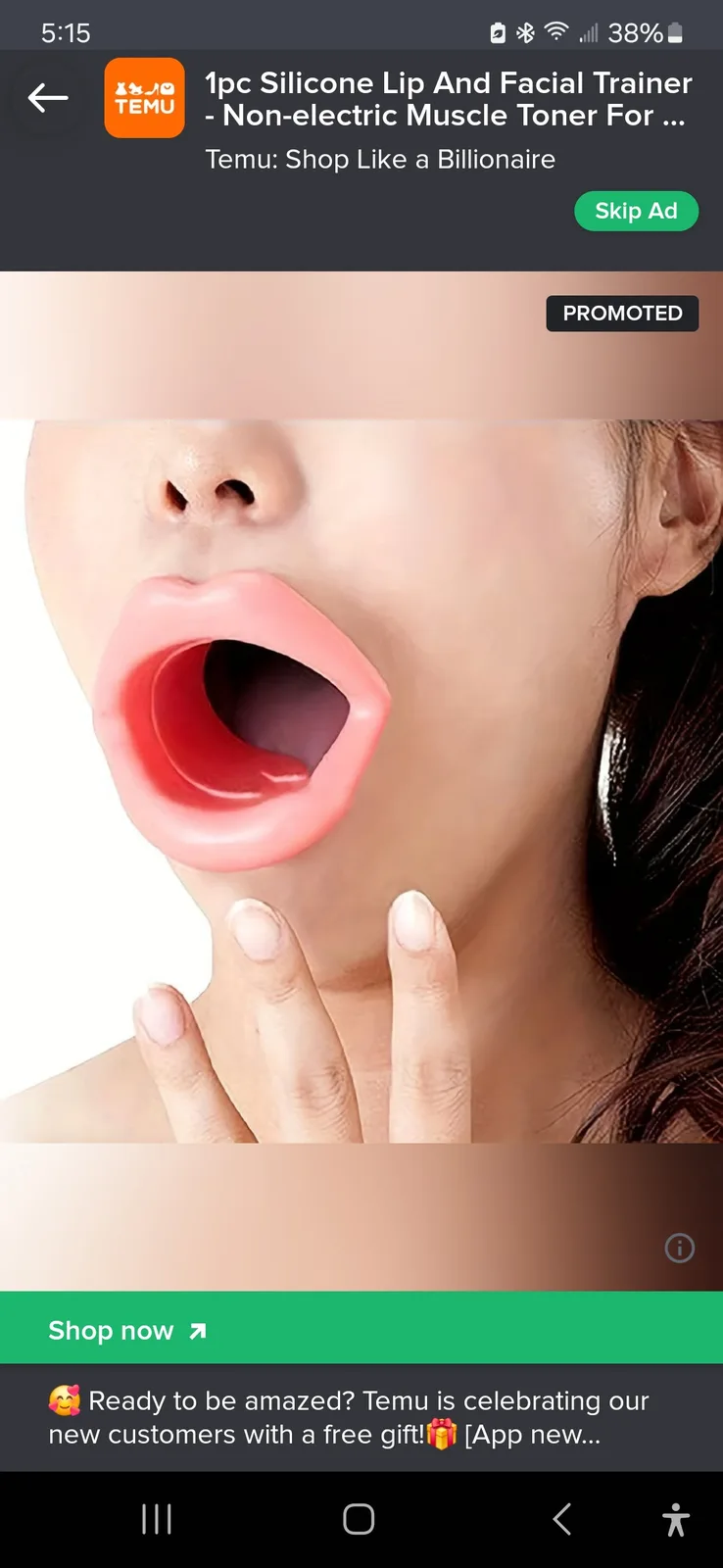 A close-up image shows a person's face with a large, pink silicone lip trainer inserted into their mouth, making their lips…