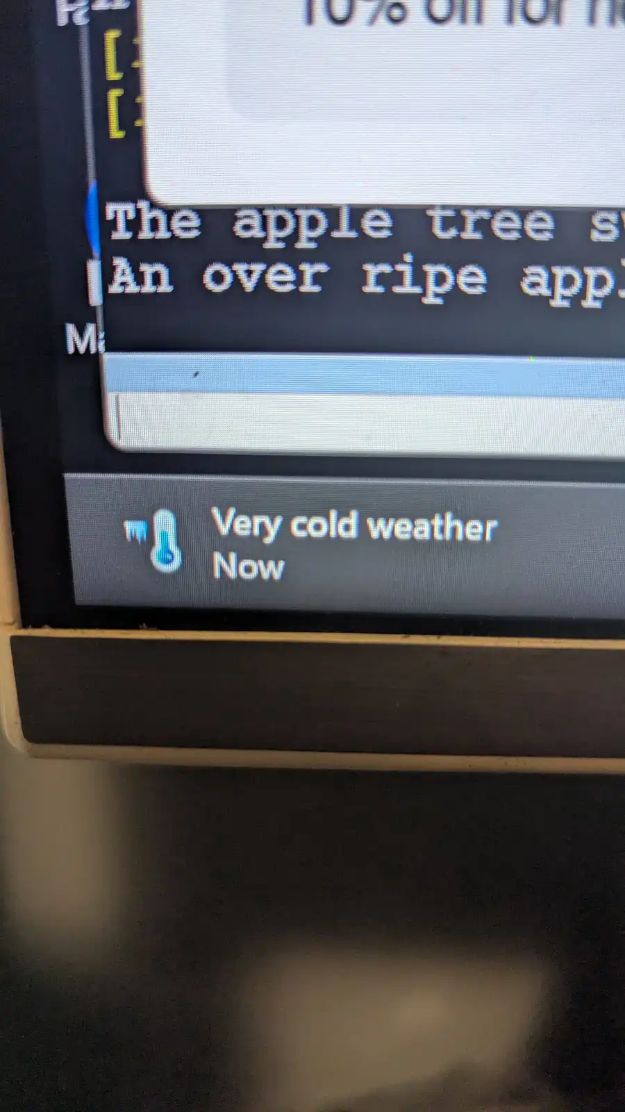 A close-up of a computer screen displaying a game interface with pixelated text. The visible text reads 'The apple tree s'…