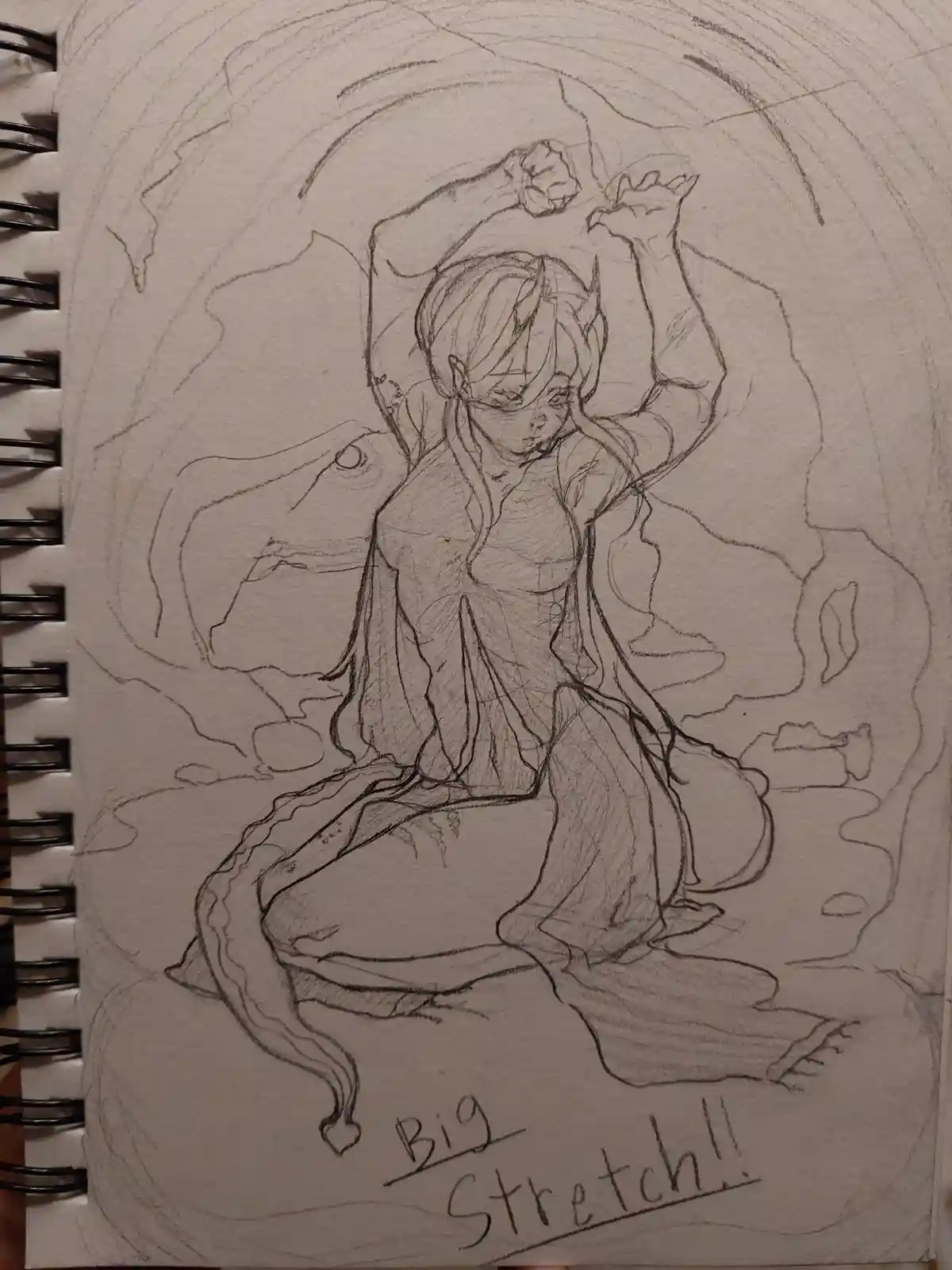 A pencil sketch in a spiral-bound notebook shows an anime-style character with long hair and pointed ears stretching…