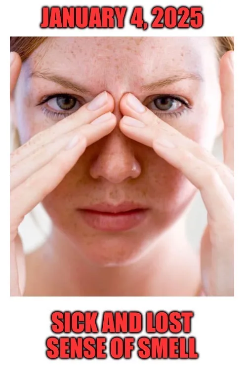 A close-up photo of a woman with freckles pressing her index fingers against her nose bridge, eyes wide and expression…