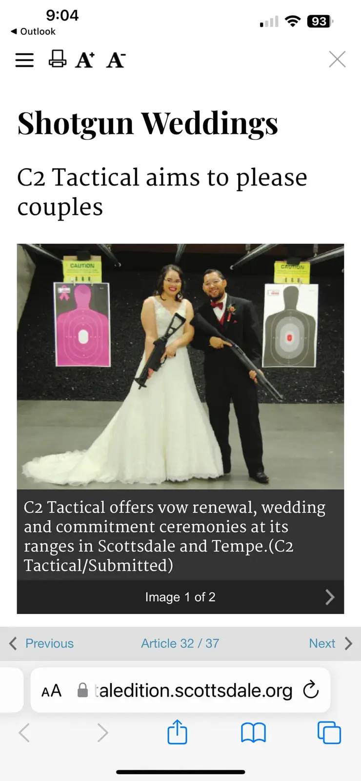 A bride in a white wedding dress and a groom in a black tuxedo are posing together in an indoor shooting range, each holding…