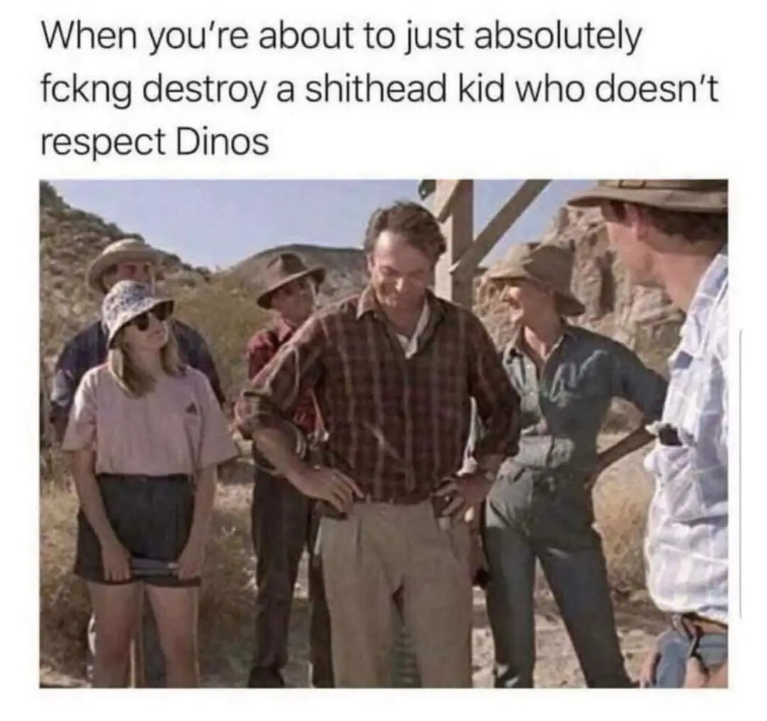A still from the movie 'Jurassic Park' shows Dr. Alan Grant (Sam Neill) looking down with a stern, almost amused expression…