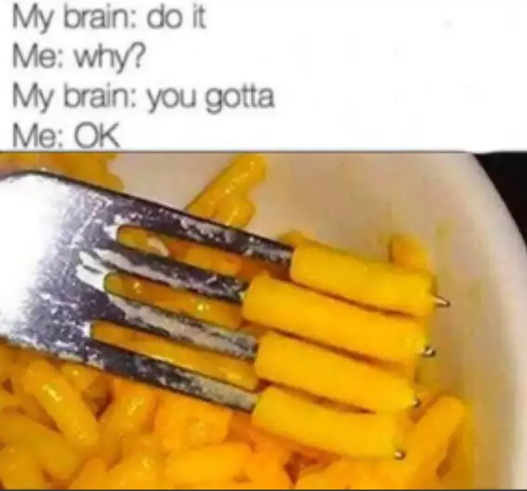 A close-up image shows a metal fork stuck into a pile of yellow macaroni and cheese in a white bowl. The fork has sauce and…