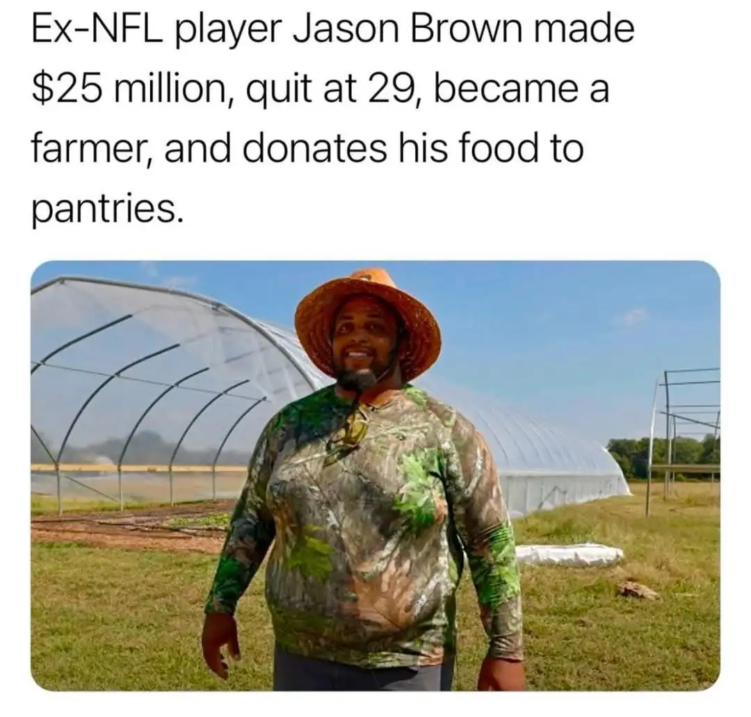 A smiling Black man wearing a camouflage shirt and a straw hat stands outdoors in front of a large greenhouse. The text…