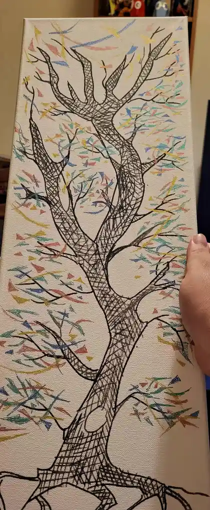 A hand holds up a canvas painting of a stylized tree with a black ink outline and cross-hatched shading. The tree's branches…