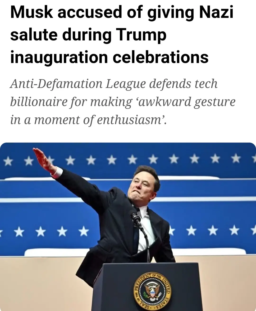 A man in a dark suit stands at a podium with the Seal of the President of the United States, raising his right arm in a…