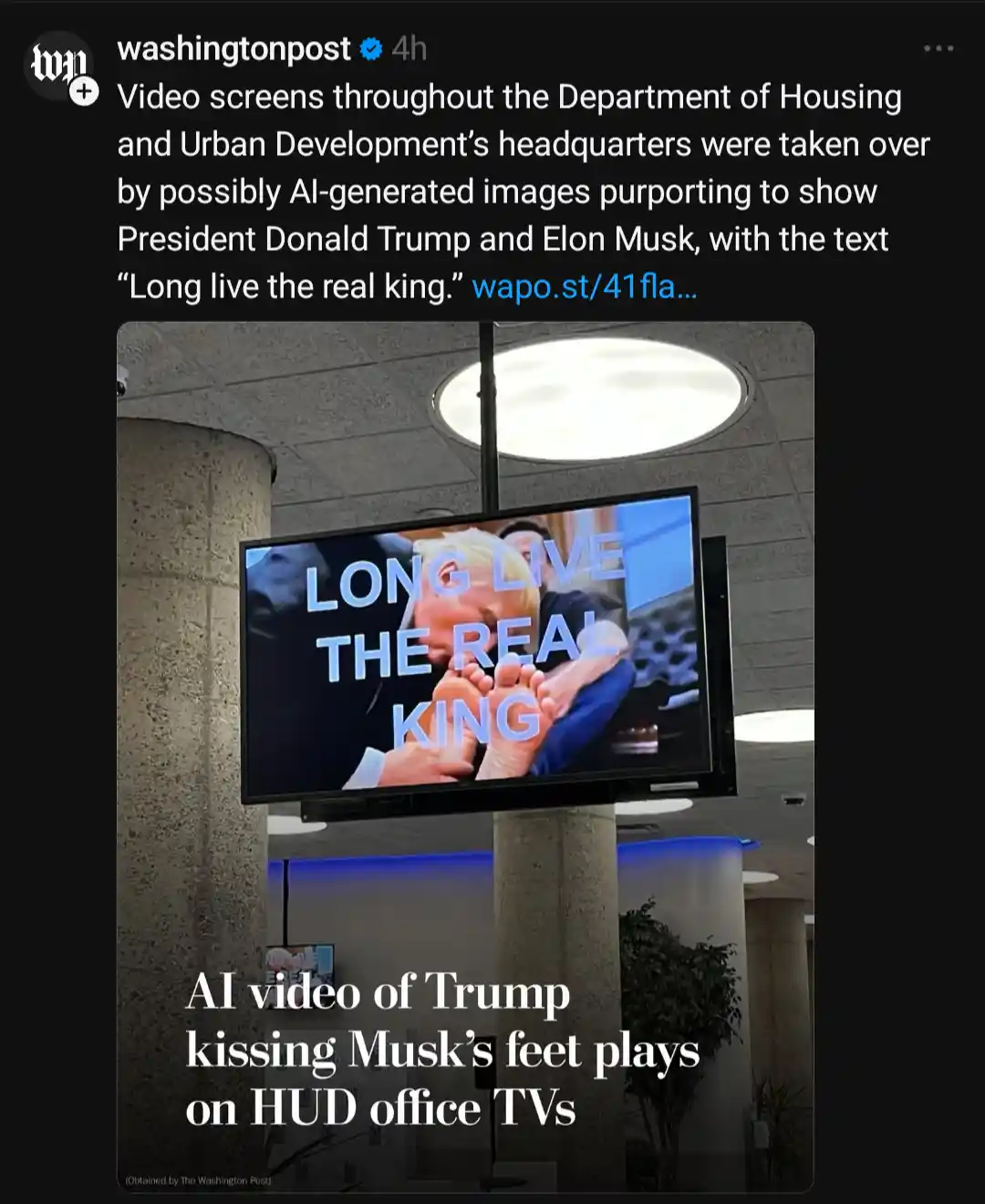 A television screen in a government building displays an AI-generated image of Donald Trump kissing Elon Musk's feet…
