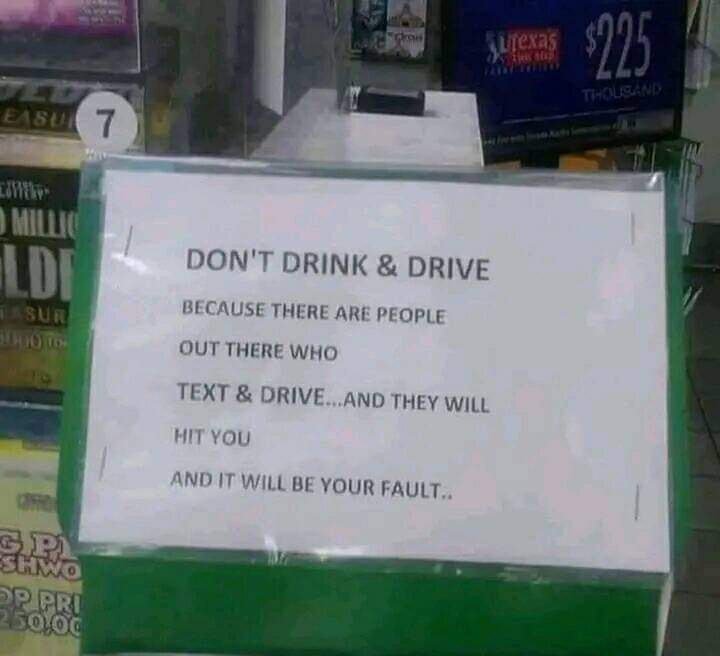 A white sign taped to a green surface in what appears to be a convenience store or gas station, with overlaid text warning…