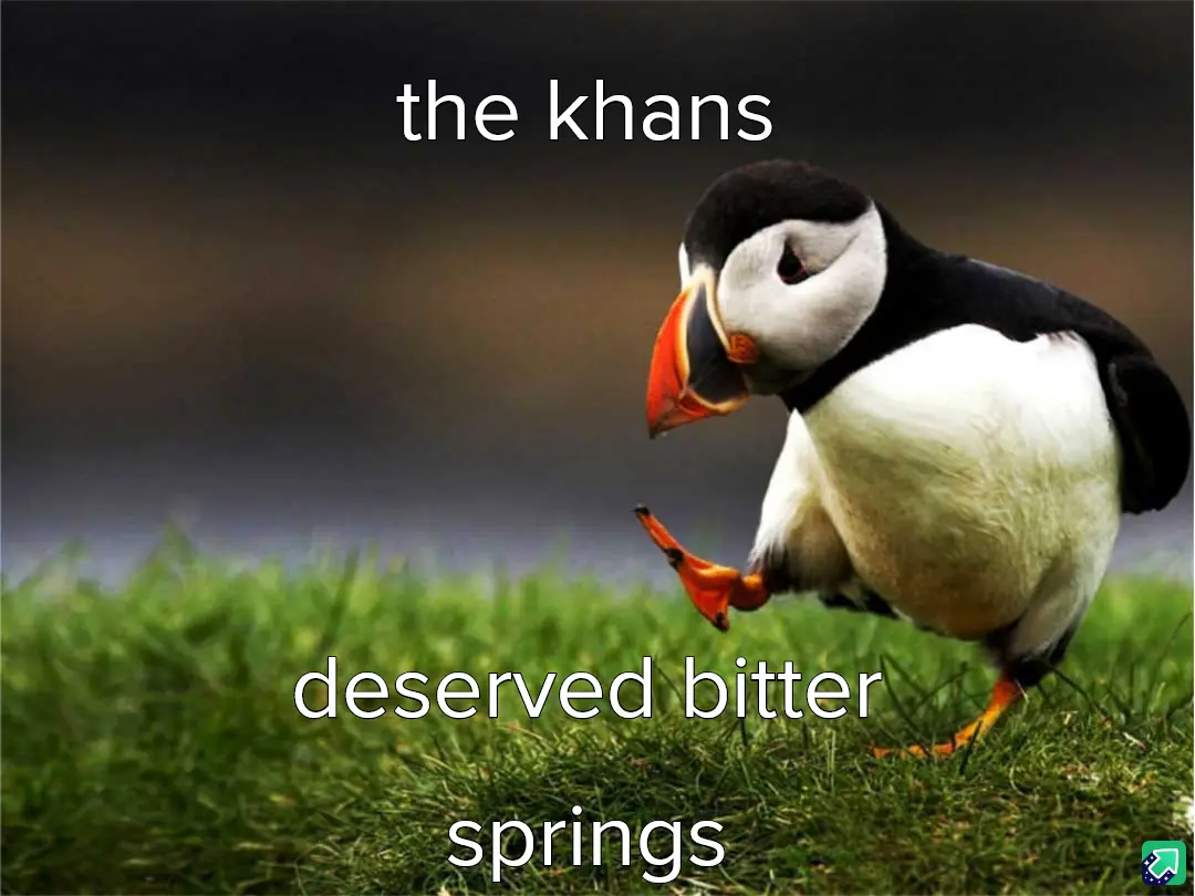 A puffin stands on green grass, looking down with one foot lifted, as if in a moment of regret or contemplation. White text…