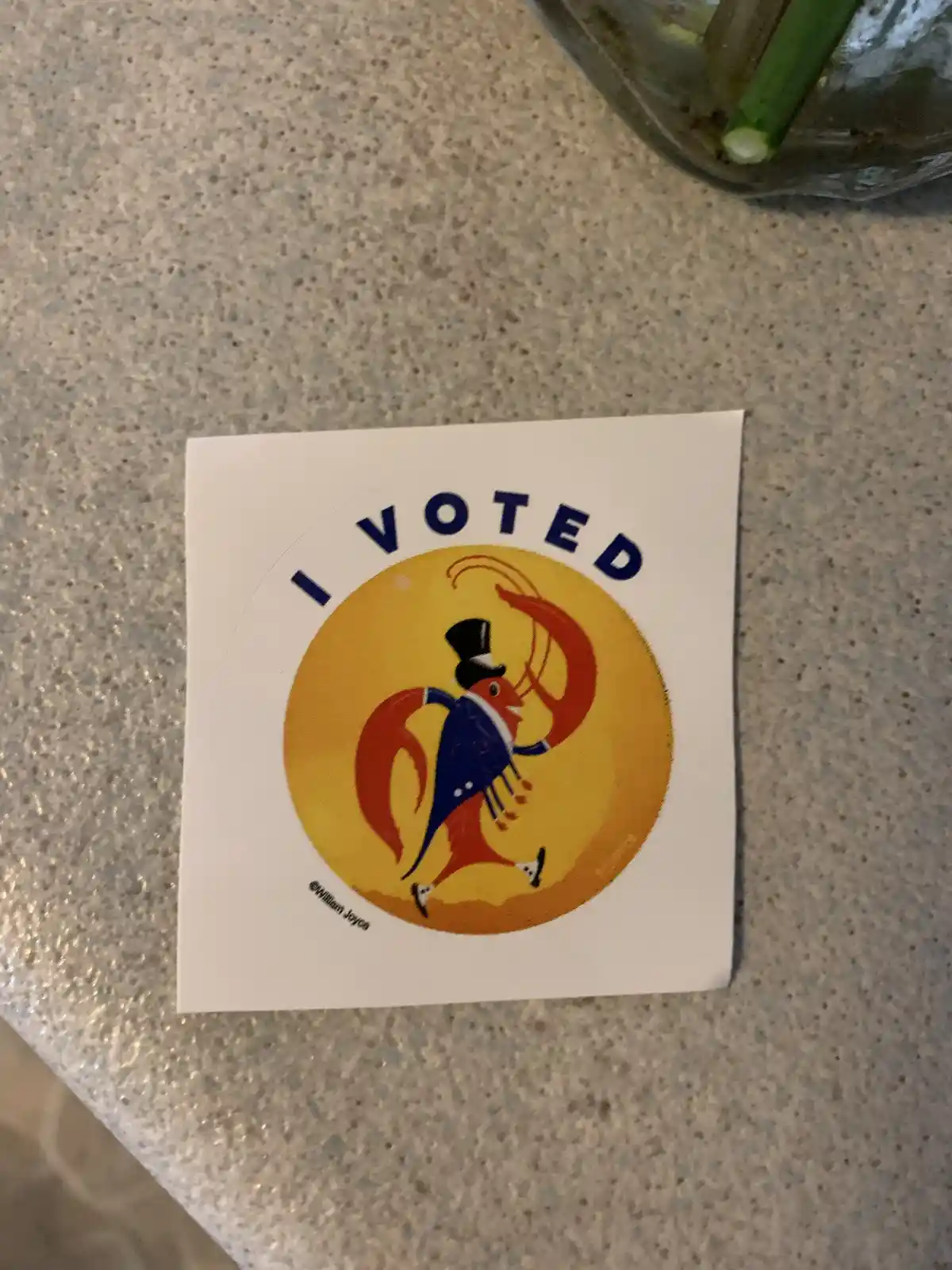 A square sticker with a yellow circular design featuring a cartoon lobster wearing a top hat and a blue suit, standing on…