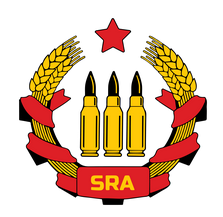 A stylized emblem featuring three golden bullets centered between two golden wheat sheaves, all encircled by a red ribbon…