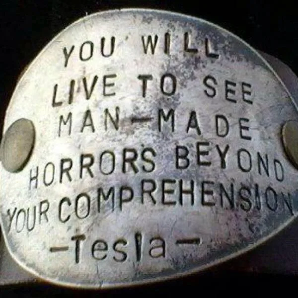 A close-up of a weathered, oval-shaped metal plaque with embossed text that reads 'YOU WILL LIVE TO SEE MAN-MADE HORRORS…