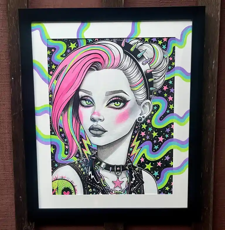 A framed, stylized illustration of a woman with vibrant pink and rainbow-colored hair, green eyes, and punk accessories like…