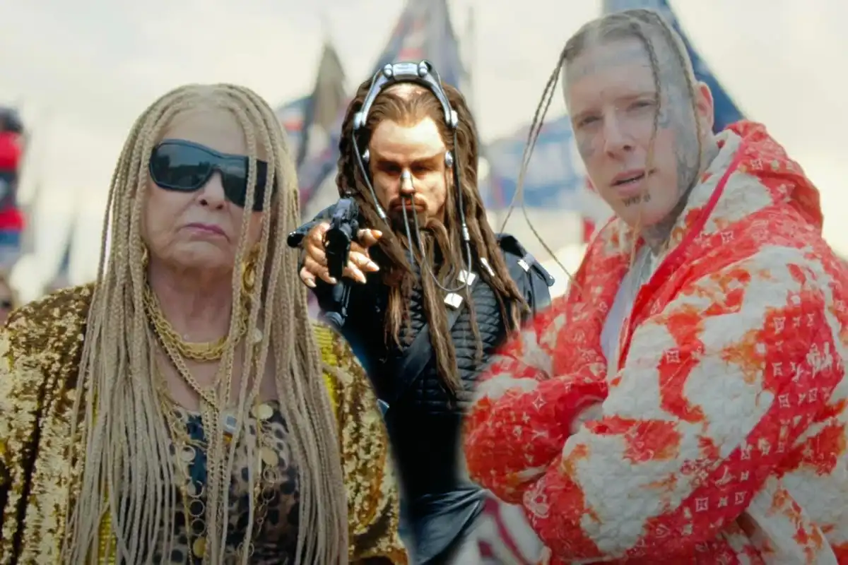 Three people stand side-by-side: a woman with blonde braids and sunglasses, a man with dreadlocks holding a gun and wearing…