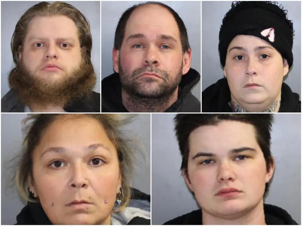 Five mugshot-style photos of different individuals arranged in a grid, each with a neutral expression. The text overlay…