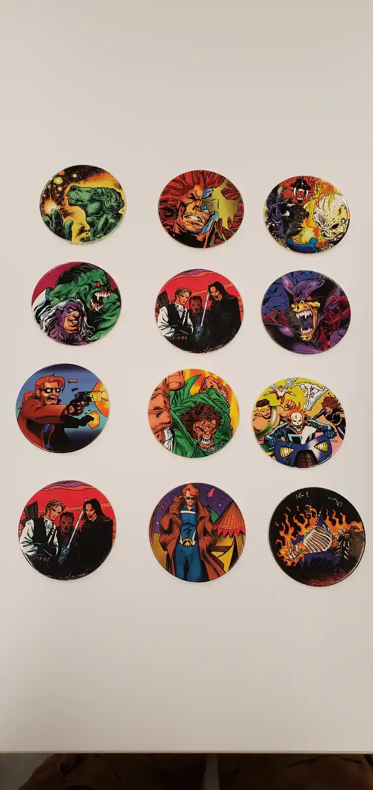 Ten circular comic book-style badges are arranged in a grid on a plain white surface, each depicting a different illustrated…
