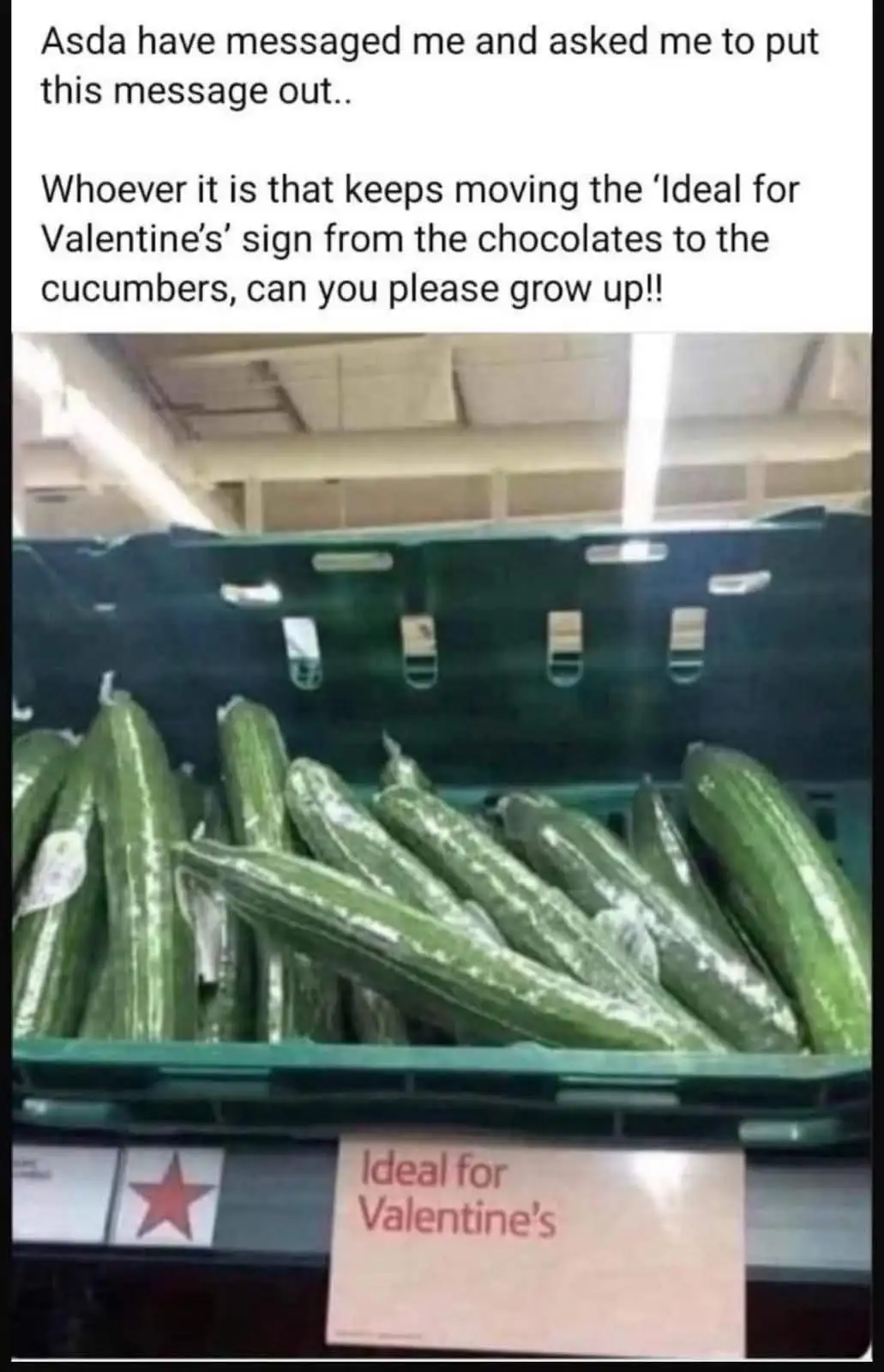 A supermarket shelf displays a bin of cucumbers with a sign reading 'Ideal for Valentine's' placed beside them, humorously…