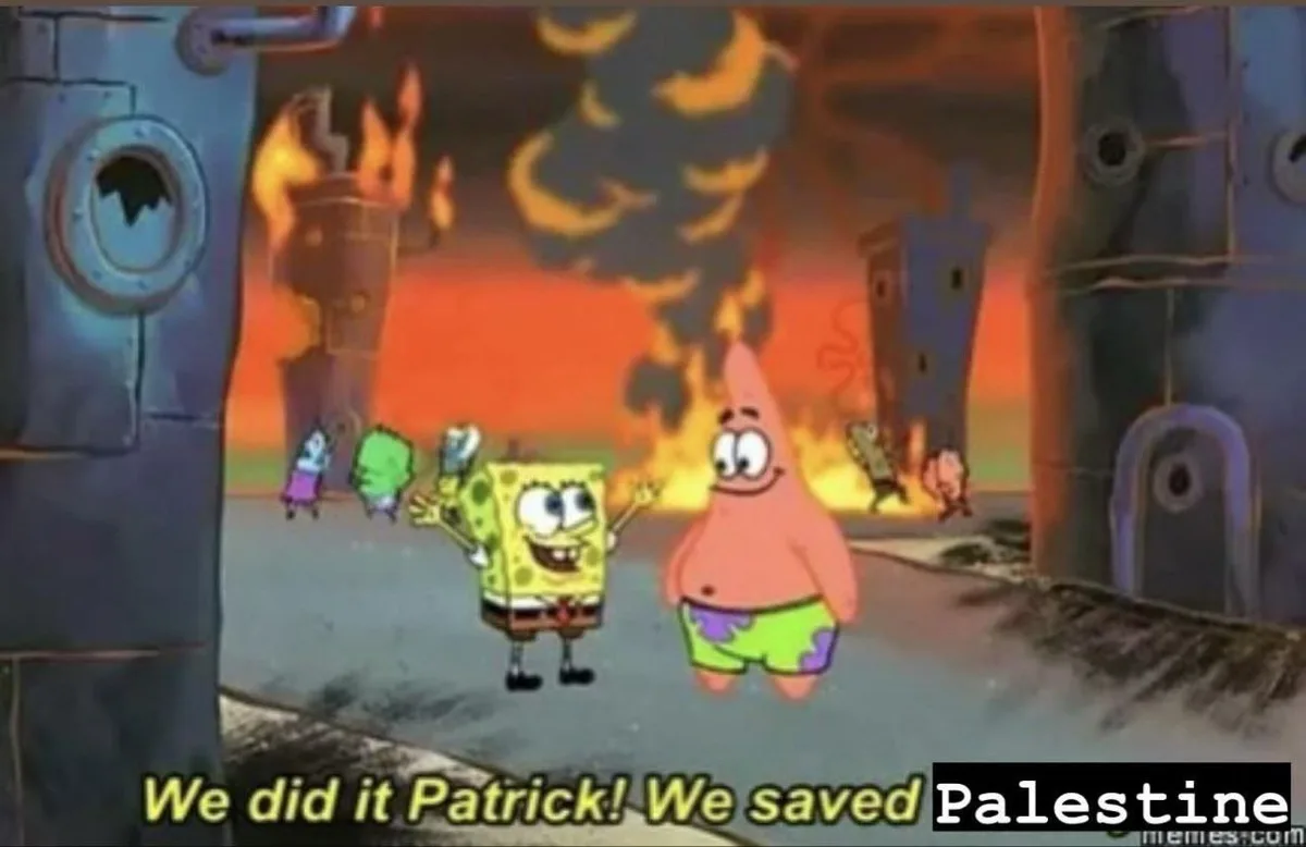 In a scene from SpongeBob SquarePants, SpongeBob and Patrick stand in front of a burning, ruined cityscape with other…