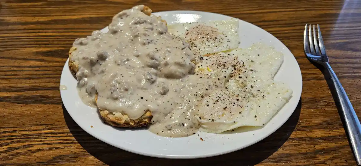 A Delicious Plate of Biscuits, Sausage Gravy, and Eggs