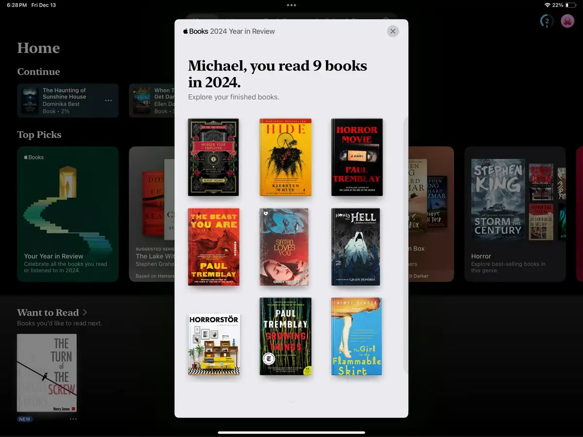 An Apple Books 'Year in Review' pop-up for a user named Michael, showing a grid of nine book covers, all of which are horror…