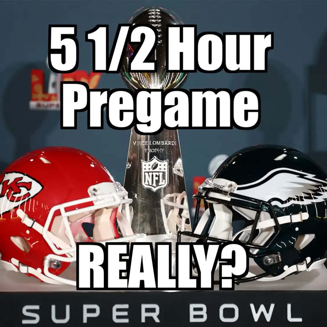 Two football helmets, one red with a KC logo and one black with a white eagle, face each other on either side of the Vince…