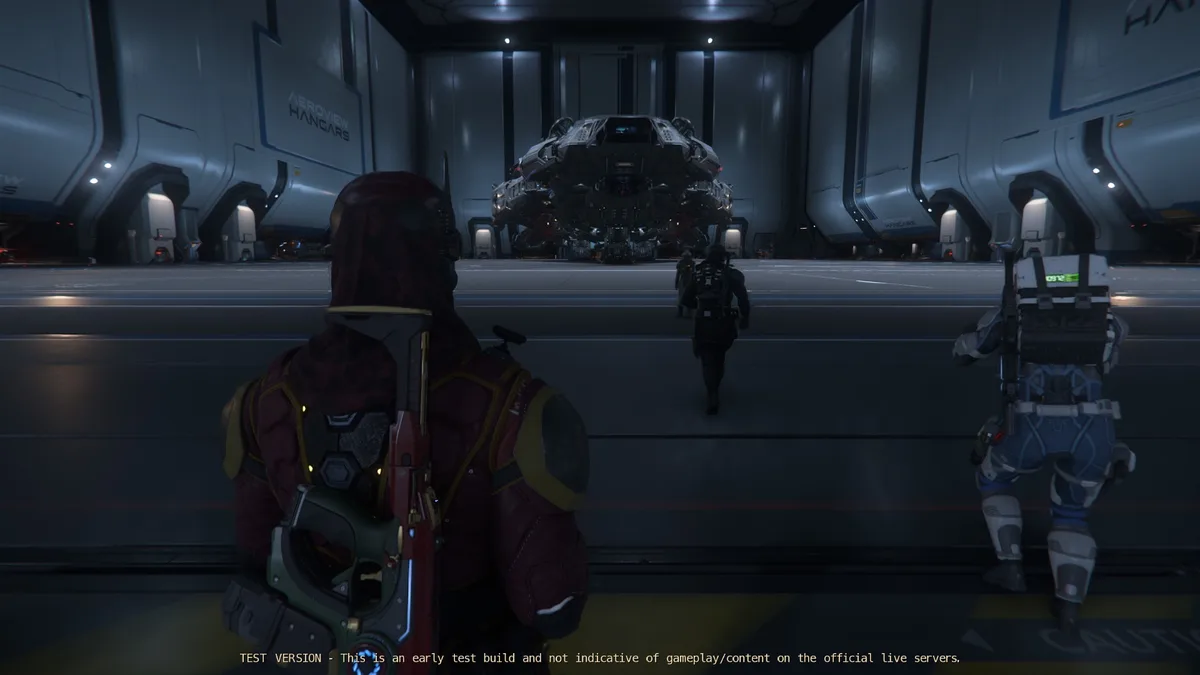 Three armored characters stand in a futuristic hangar, facing a large, complex spacecraft. The character in the foreground…