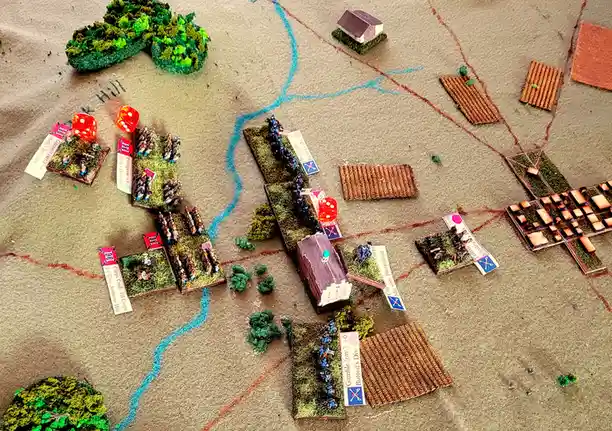 An overhead view of a miniature wargaming setup depicting a Civil War battle, with small plastic soldier figures on grassy…