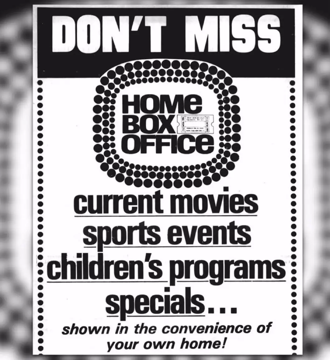 A vintage black-and-white advertisement for 'Home Box Office' features bold text listing offerings like current movies…